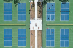 Aerial view of eight pickleball courts, arranged four by two