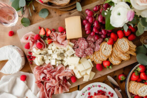 A vibrant charcuterie board filled with snacks