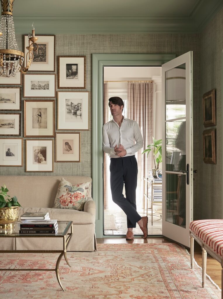 Brian Patrick Flynn Standing in the Doorway of a Well-Decorated Room